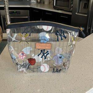 Dooney & Bourke clear travel bag.